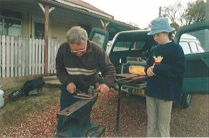 Shaping a horse shoe with Sally supervising